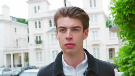 Head-And-Shoulders-Of-Stylish-Man-Walking-Along-City-Street