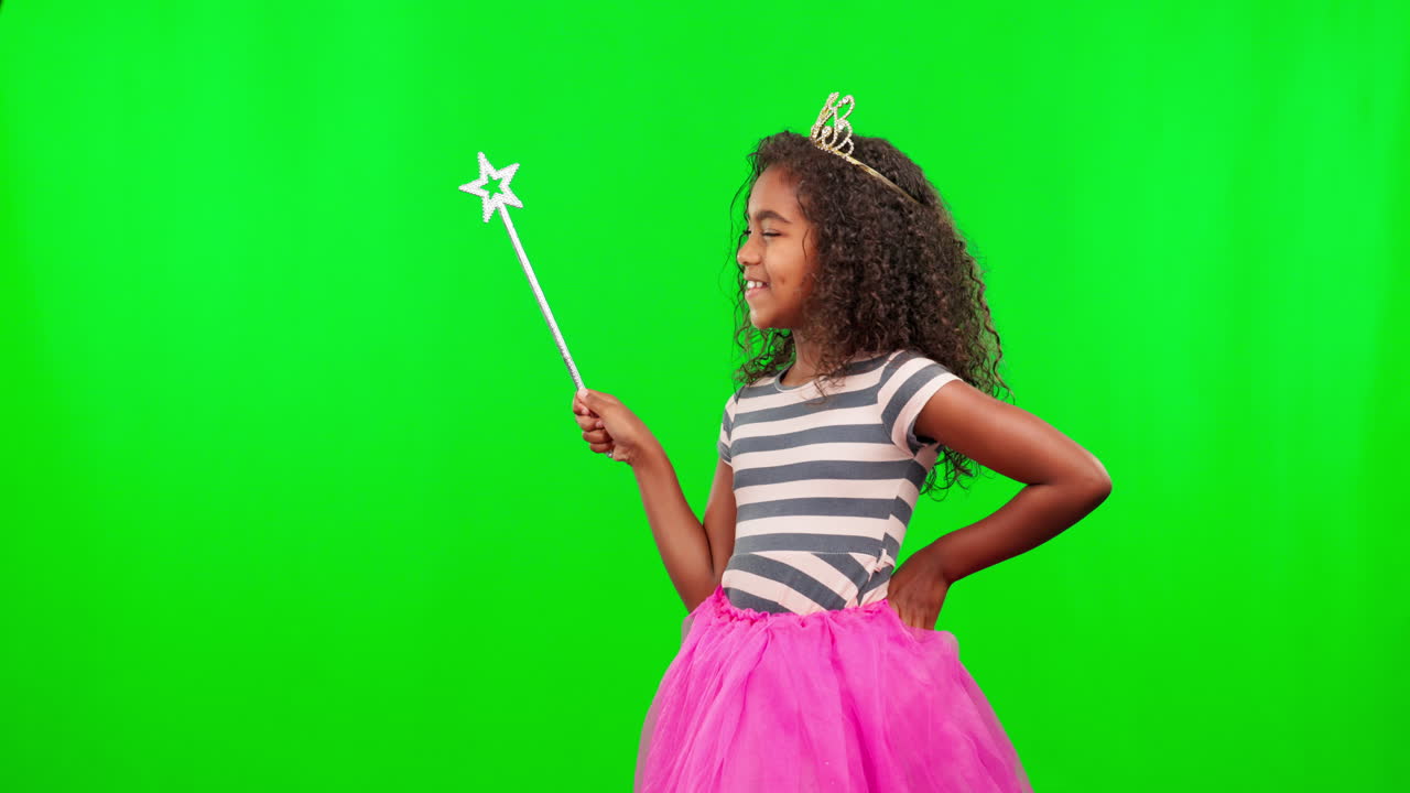 Child in costume, green screen with wand