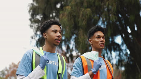 two young men volunteering in their community