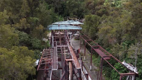 Drone-flight-over-the-ruins-of-the-old-cable-car-station-El-Liron,-located-in-San-Antonio-de-Galipan,-Venezuela