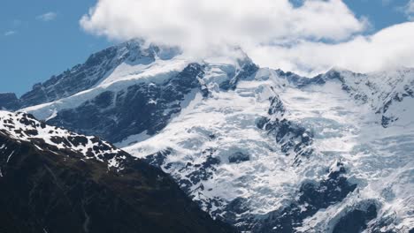 close up view of snowy mountains, glaciers and mount sefton on a sunny summer day in mount cook national park, new zealand.