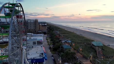 sunrise over ferris wheel at carolina beach boardwalk amusement park in carolina beach nc, north carolina near wilmington nc