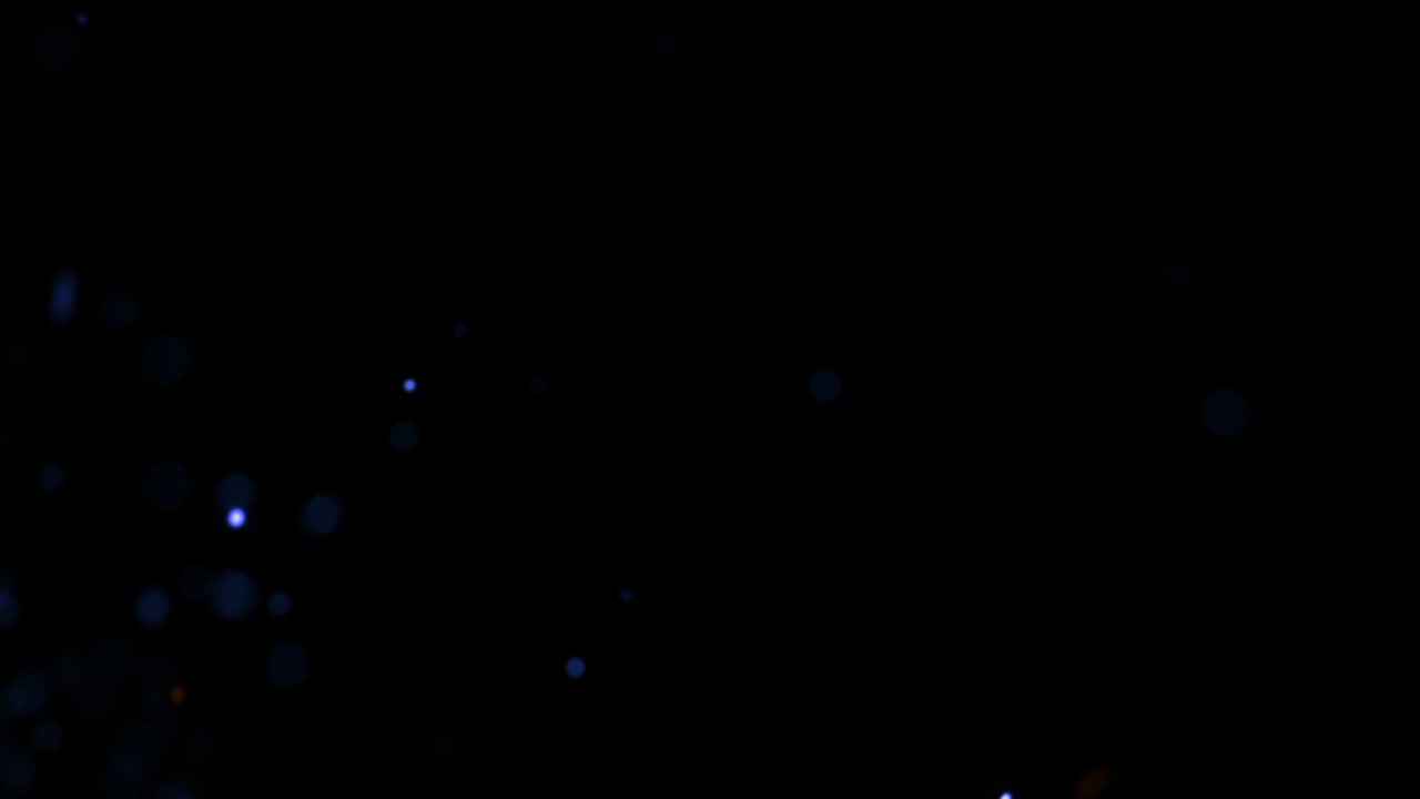 volar pequeñas partículas azules y doradas con humo oscuro