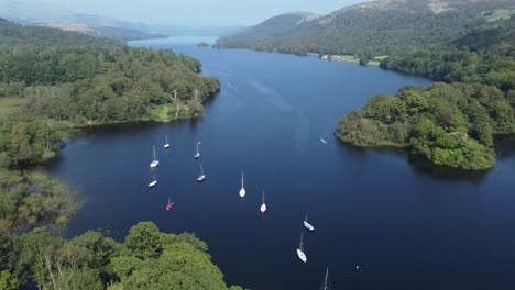 drone footage showing coniston lake in the lake district, cumbria, uk and looking north from the south of the lake