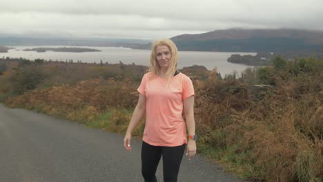 woman joyful in front of beautiful lake view