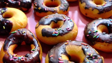 close up of chocolate donuts on plate