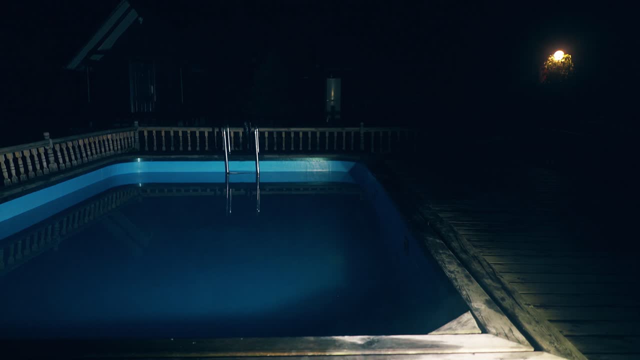 Pool illuminated at night From the water is steam