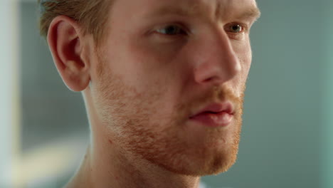 handsome guy looking screen closeup. focused manager analyzing problem in office