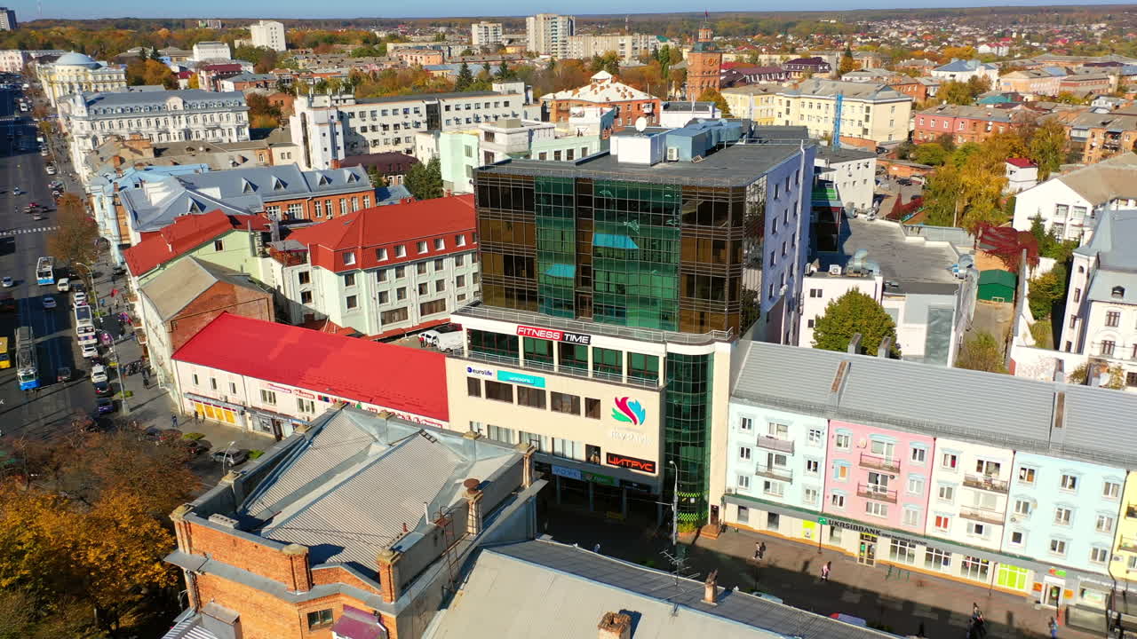 Circling around the beautiful downtown on daytime. Drone footage over the urban cityscape.
