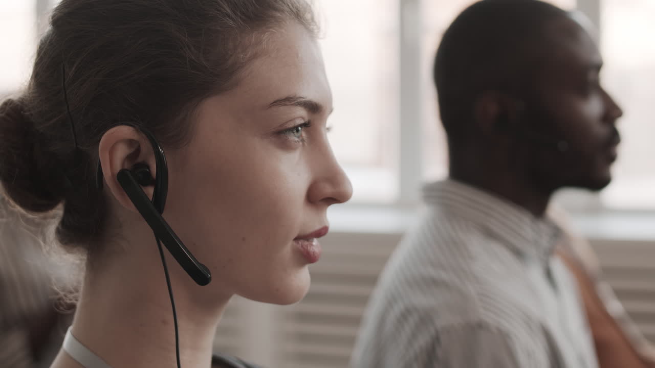 Woman with Headset Looking and Nodding