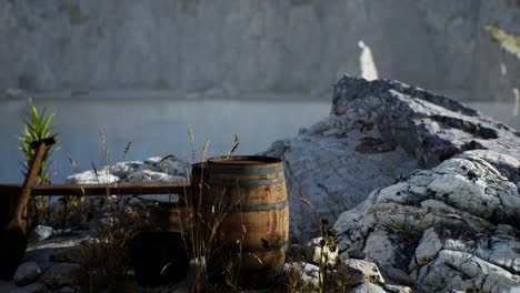 wooden barrels with sea fish at the sand beach