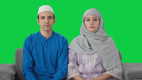 serious muslim couple staring at the camera green screen