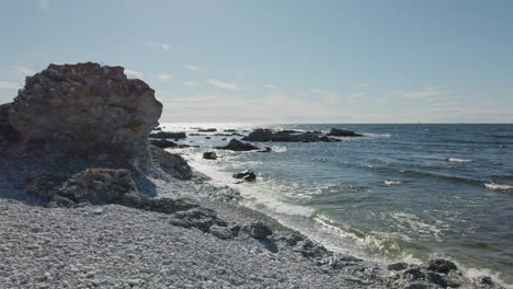 beautiful seascape with rauk formation. handheld, pan right