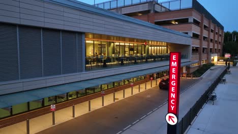 neon emergency sign at hospital in usa at night