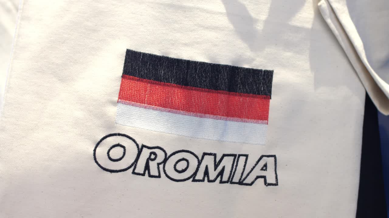 Oromia flag on handmade T-shirt displayed in showroom