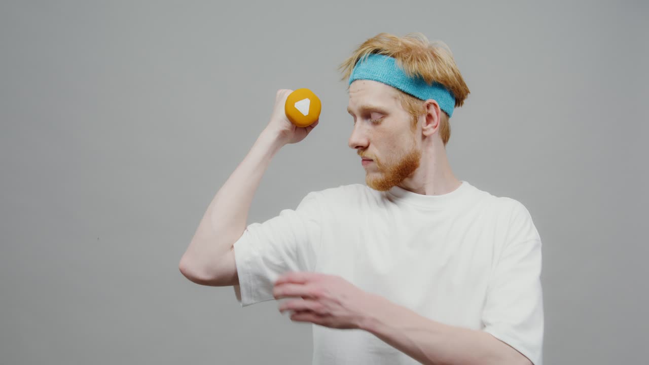 Man flexing with dumbbell