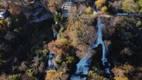 Aerial-top-down-shot-of-flowing-Edessa-Waterfalls-during-sunny-day-in-Greece