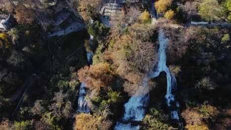 aerial top down shot of flowing edessa waterfalls during sunny day in greece