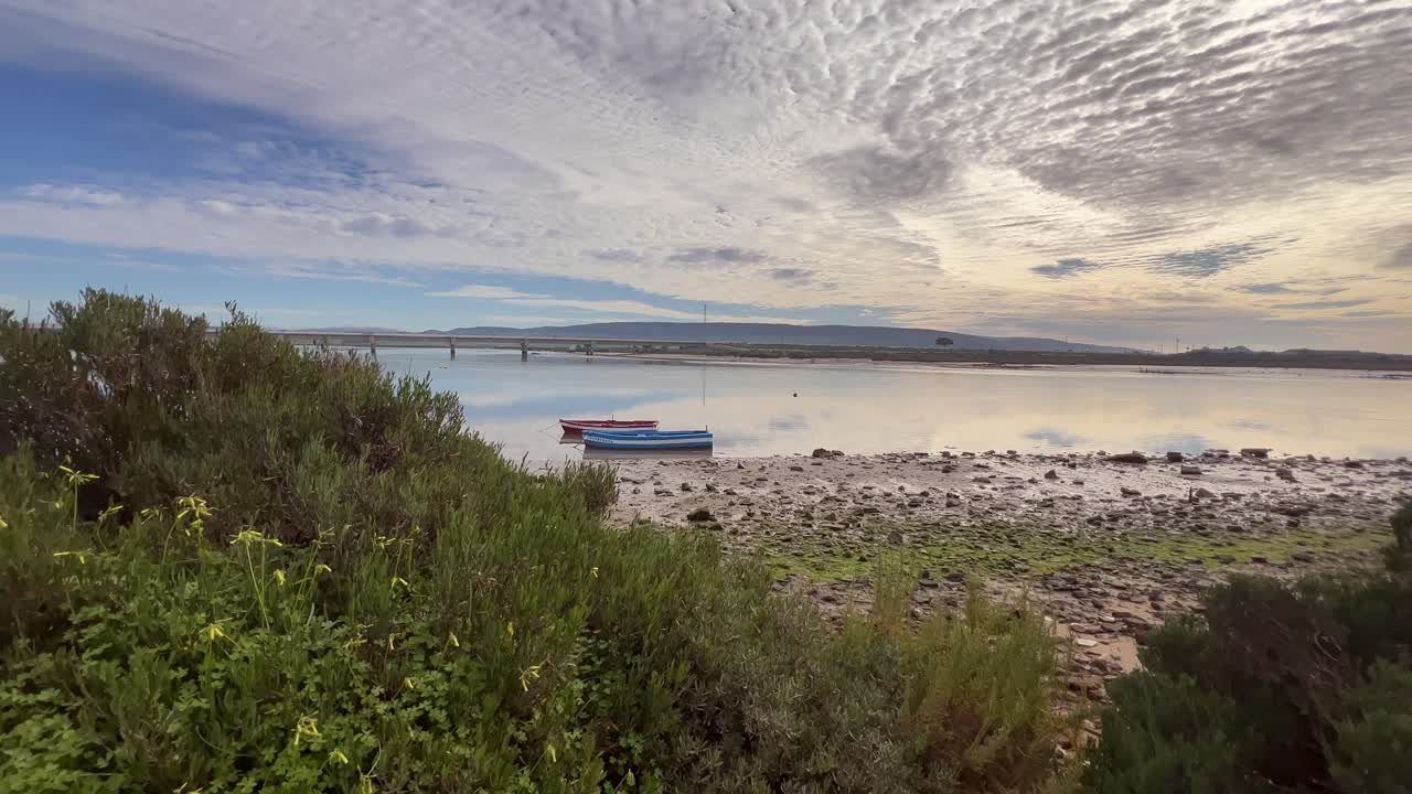 beautiful panorama of the beach with boats and a beautiful sky with clouds