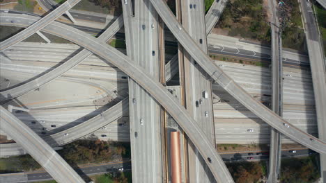 AERIAL:-Close-Flight-over-Judge-Pregerson-Huge-Interchange-Connection-showing-multiple-Roads,-Bridges,-Highway-with-little-car-traffic-in-Los-Angeles,-California-on-Beautiful-Sunny-Day