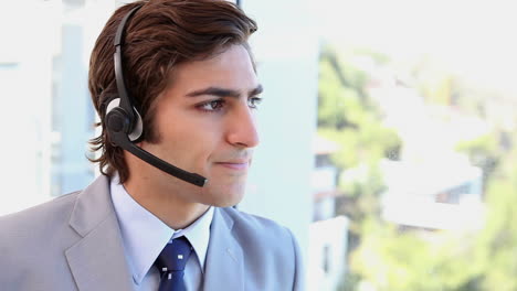 a businessman talking with a headset