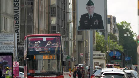 establishing shot of the famous tourist attraction, checkpoint charlie, berlin, germany.