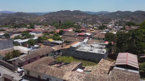 low aerial reveals quaint town streets, buildings of gracias, honduras