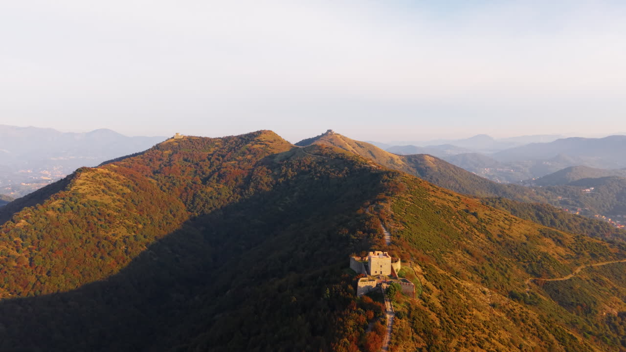 Aerial view of ancient Italian fort in lush autumn mountainscape