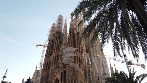 panoramic establishing shot of barcelona's sagrada familia gaudi's cathedral under construction