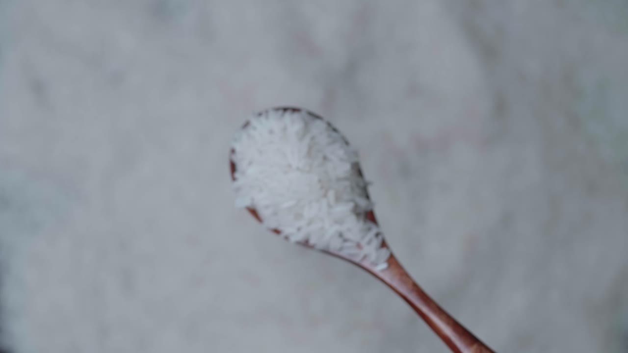 Seeds Rice On A Wooden Spoon Moving Up