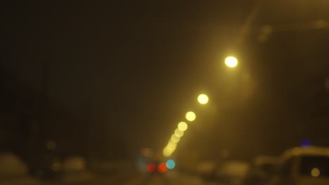 yellow color streets lights glowing at nigh time, driving, blurry view