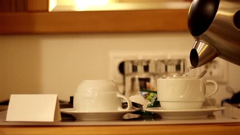 Man-Is-Filling-Tea-In-Hotel