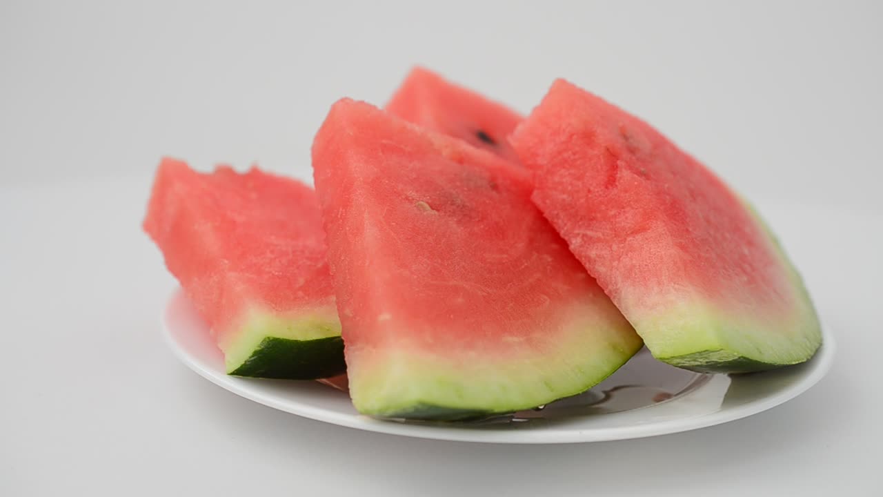 Shooting of pieces of a watermelon. Shooting in the movement