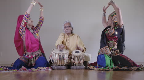 indian percussion musician with dancers 00