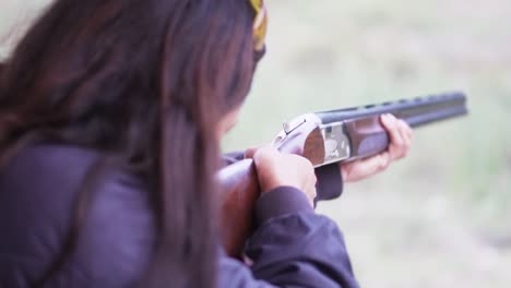 girl shooting a gun, rifle