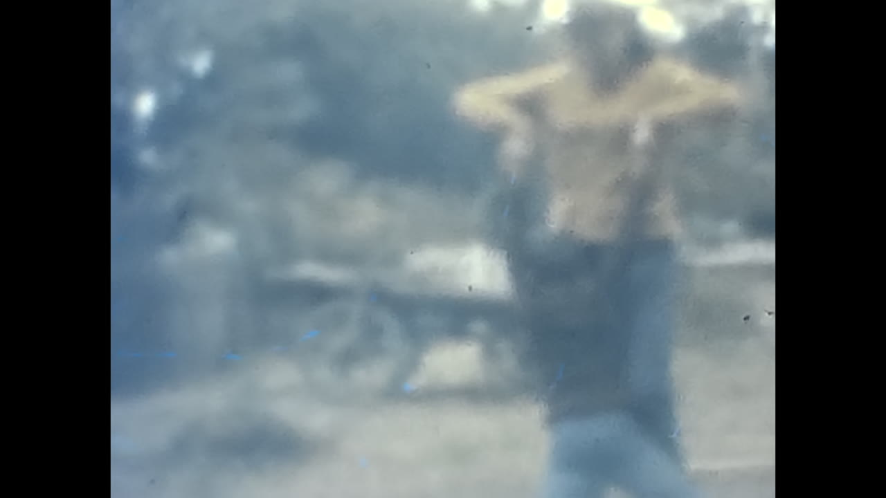 Little Boy Standing Next to an Older Woman in Soviet Era. CIRCA USSR 1980s: A little boy stands next to an older woman in the historical context of the Soviet Union.