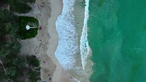 a top down shot of two sides one land and the other is ocean water