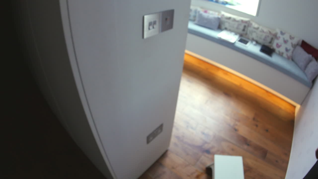 Point of view of man switching off light switch