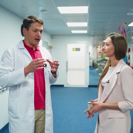 medical male specialist talking to a woman. young doctor consult a female in the rehabilitation center.