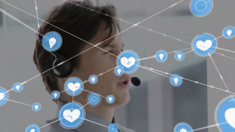 Animation-of-network-of-connections-and-icons-over-businessman-wearing-headset