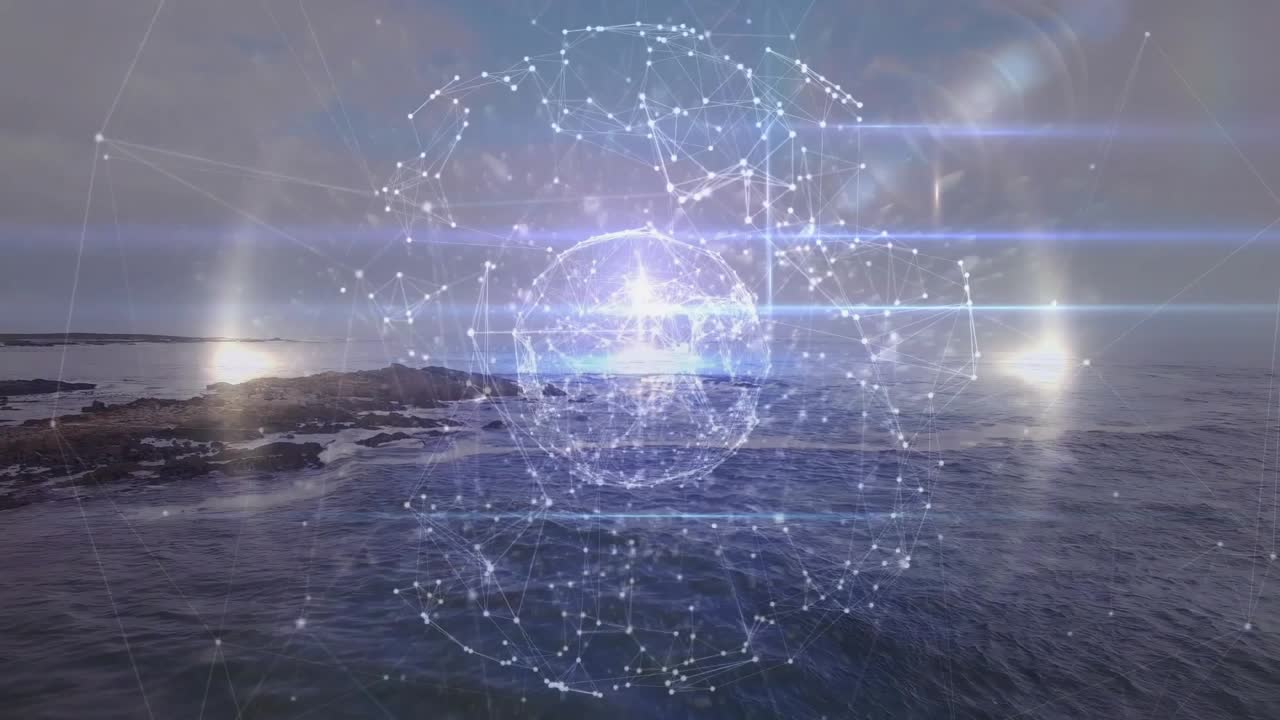 3D network sphere floating above rocky sunset coast, showing light flares and gentle waves
