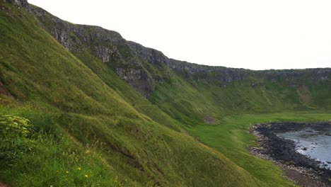 the lush green cliffs around the giant's causeway in county antrim, northern ireland at daytime
