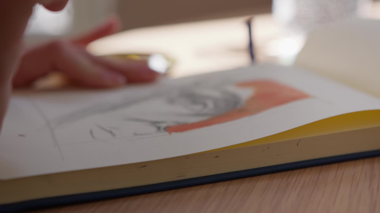 Woman's brush adds colour to her painting