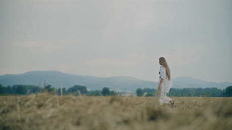 Pensive-Woman-Walking-In-Field