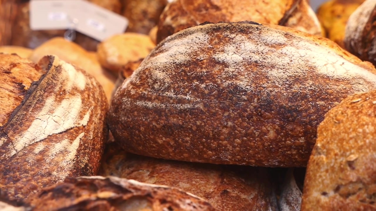 Freshly Baked Artisan Sourdough Bread Loaves in Bakery Display