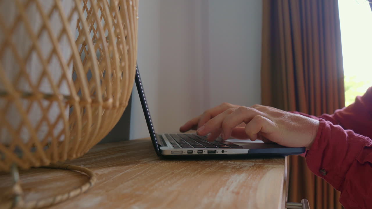 Person working on a laptop at home