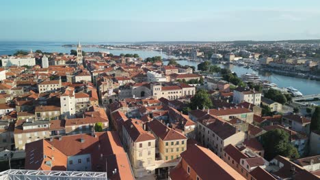 drone footage over red rooftops, bridge and kalelarga street in zadar, croatia summer morning