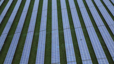 solar panels in a solar park, orbiting drone shot, 360 view, slow spinning camera