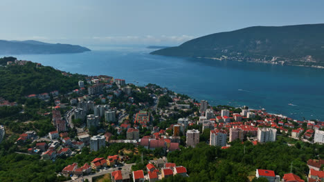 Aerial-view-circling-condos-in-the-Herceg-Novi-city,-in-sunny-day-in-Montenegro