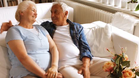 Senior-couple-romancing-in-living-room